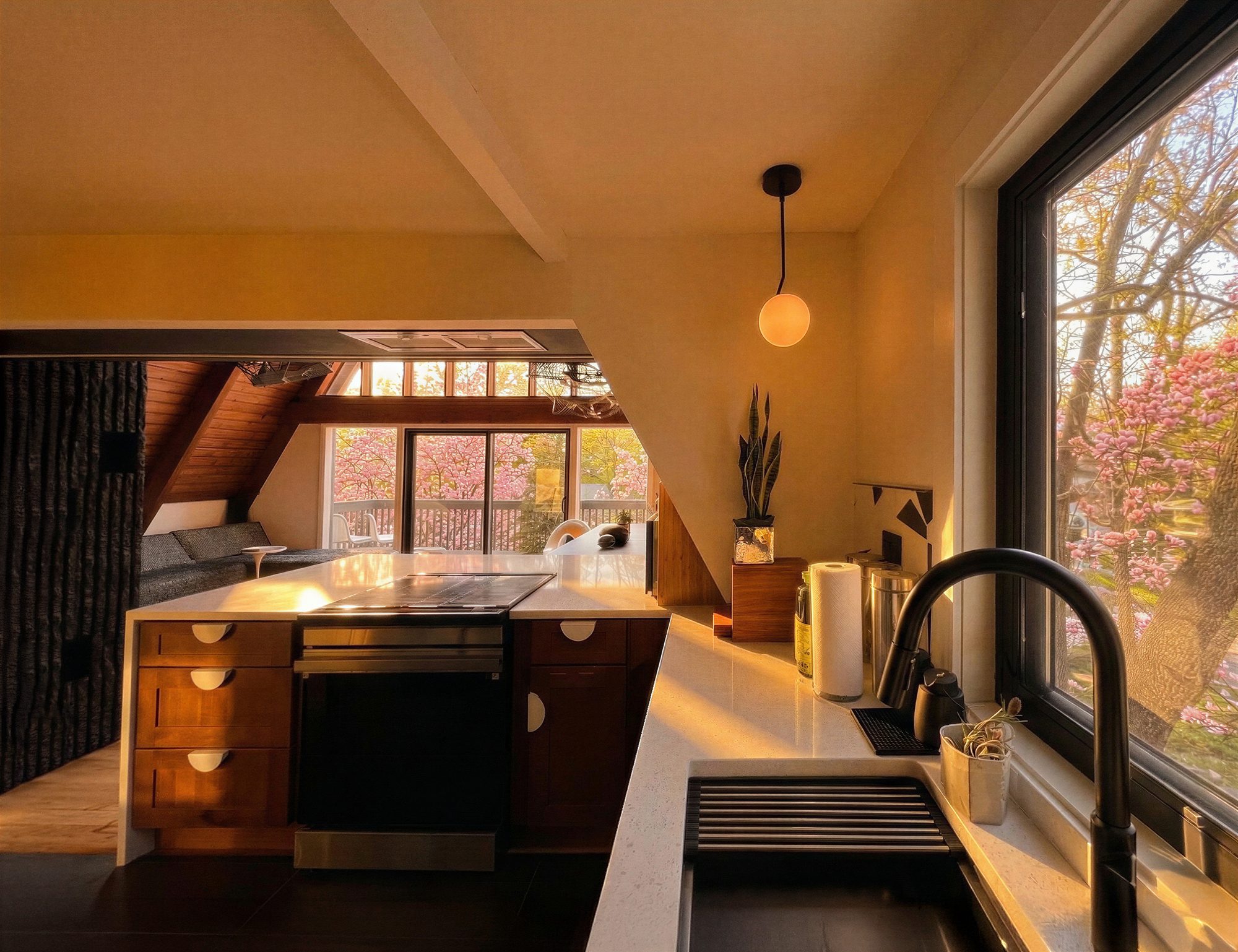 Golden hour light across the kitchen counter and faucet