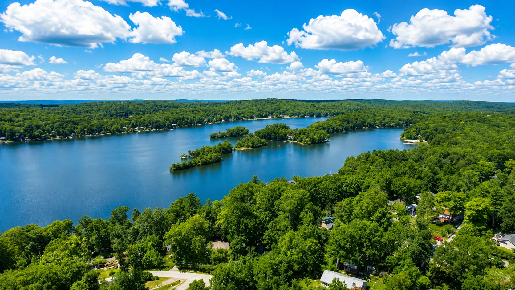Aerial view of Highland Lakes surrounded by forest